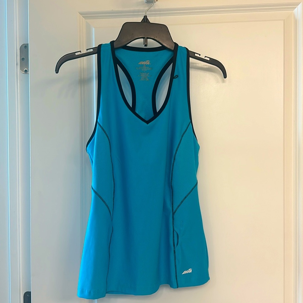 Avia workout top. turquoise, T back,inside pocket, chest liner. Size large.